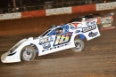 Michael Page (18x) of Douglasville, Ga., completes the pass on Jason Welshan (01) and led the final 23 laps to win Saturday's $12,000 inaugural Dixie Crate Nationals. (mitchelljphotos.com)