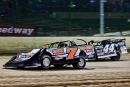 Tyler Carpenter (7) of Parkersburg, W.Va., powers away from K.C. Burdette (44) on his way to a flag-to-flag victory in the Steel Block portion of the 44th annual Dirt Track World Championship at Eldora. (Tyler Carr)