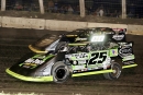 Jason Feger (25) of Bloomington, Ill., races his way inside Frank Heckenast Jr. (99jr) en route to a flag-to-flag victory in the 29th annual DIRTcar Fall Nationals at Lincoln (Ill.) Speedway. (Joseph Putnam)