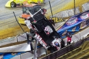 Darin Weisinger Jr. got too high in Dec. 6 heat race action to crash through the fence, necissitating a lengthy Castrol Gateway Dirt Nationals cleanup. (photosbyboyd.smugmug.com)