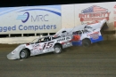 Winner Clay Stuckey (15) tangles early with Dylan Thornton (38T) en route to his Ernie Mincy Early Thaw victory at Central Arizona Raceway in Casa Grande. (speedway-shots.com)